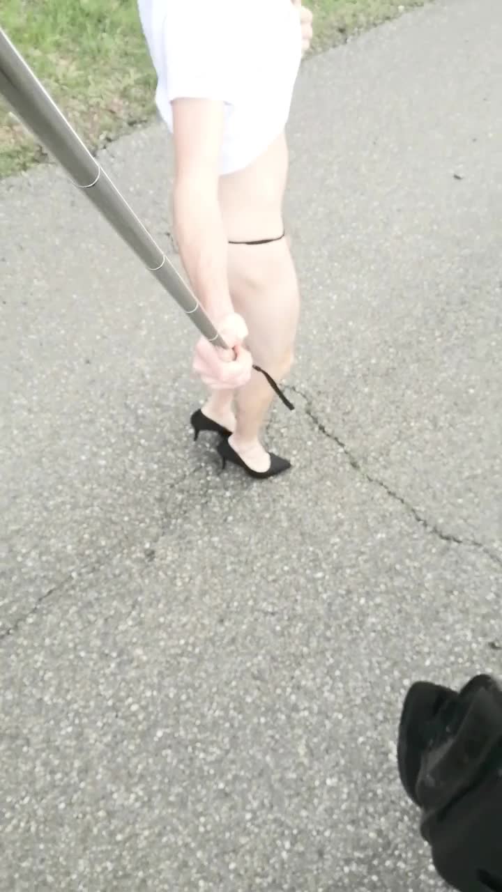 Crossdresser flashing and walking outdoor